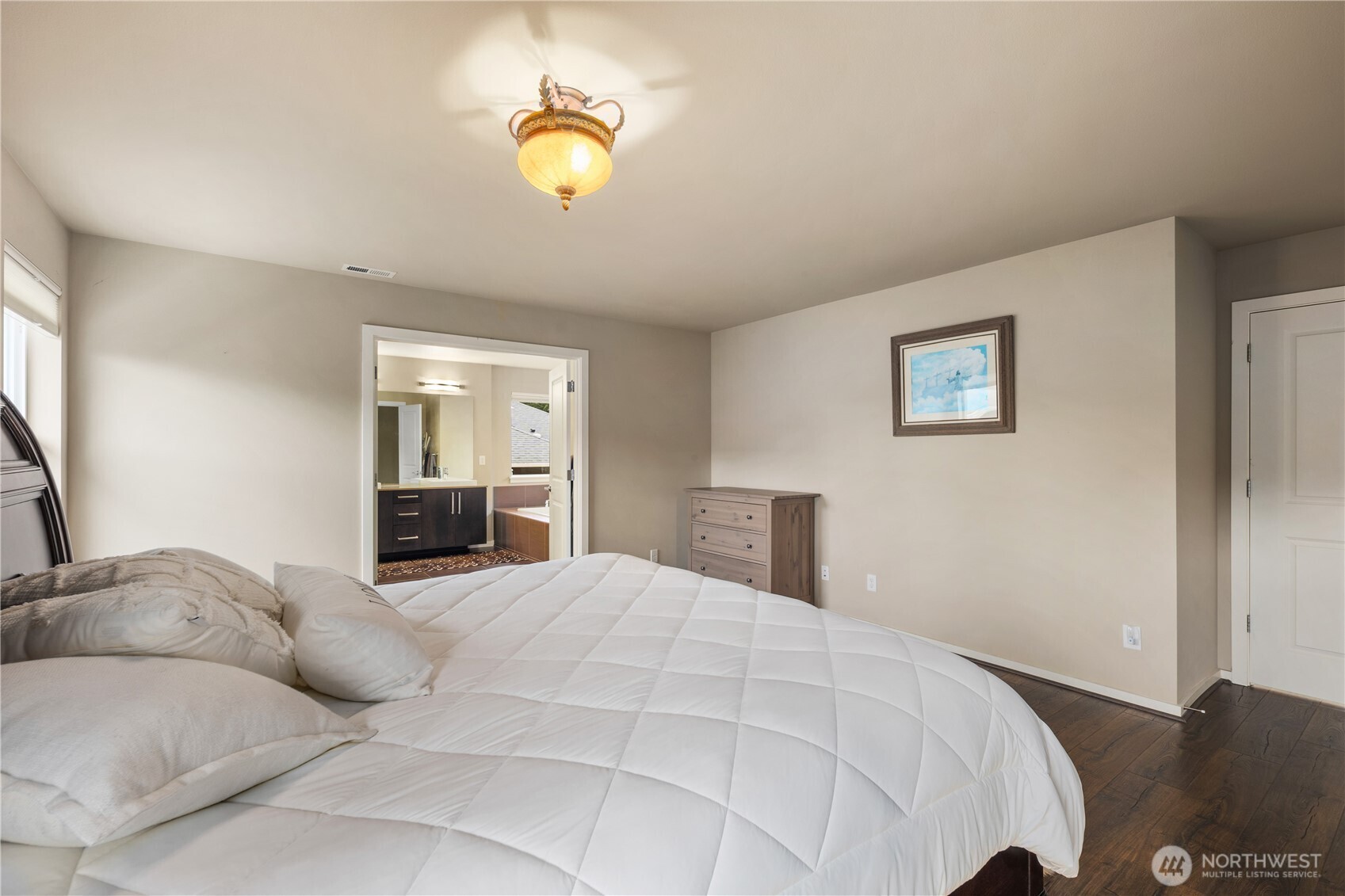 5627 South 336th Place Auburn, WA 98001 - Photo 33 of 40 a bed room with a bed and painting on the wall