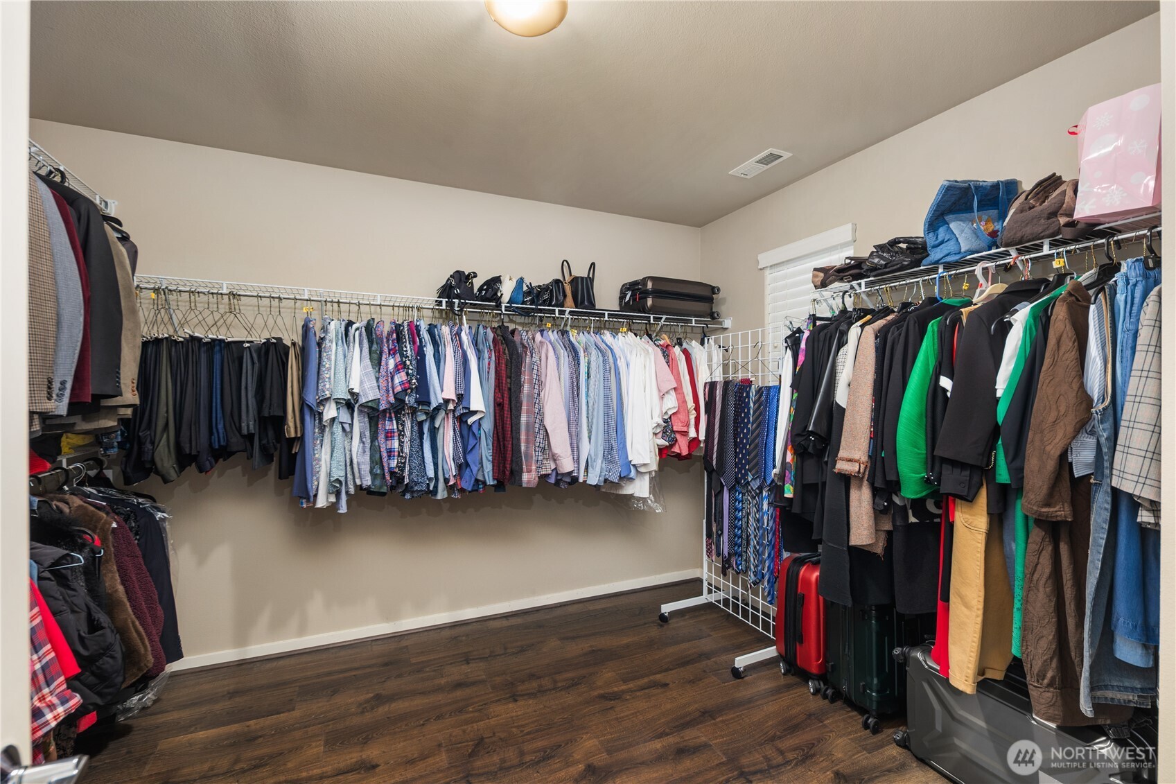 5627 South 336th Place Auburn, WA 98001 - Photo 34 of 40 a view of walk in closet with clothes