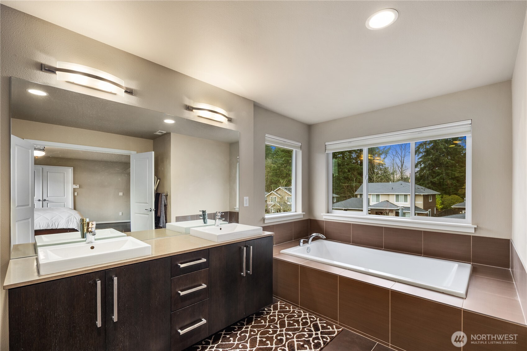 5627 South 336th Place Auburn, WA 98001 - Photo 36 of 40 a bathroom with a sink double vanity and a mirror