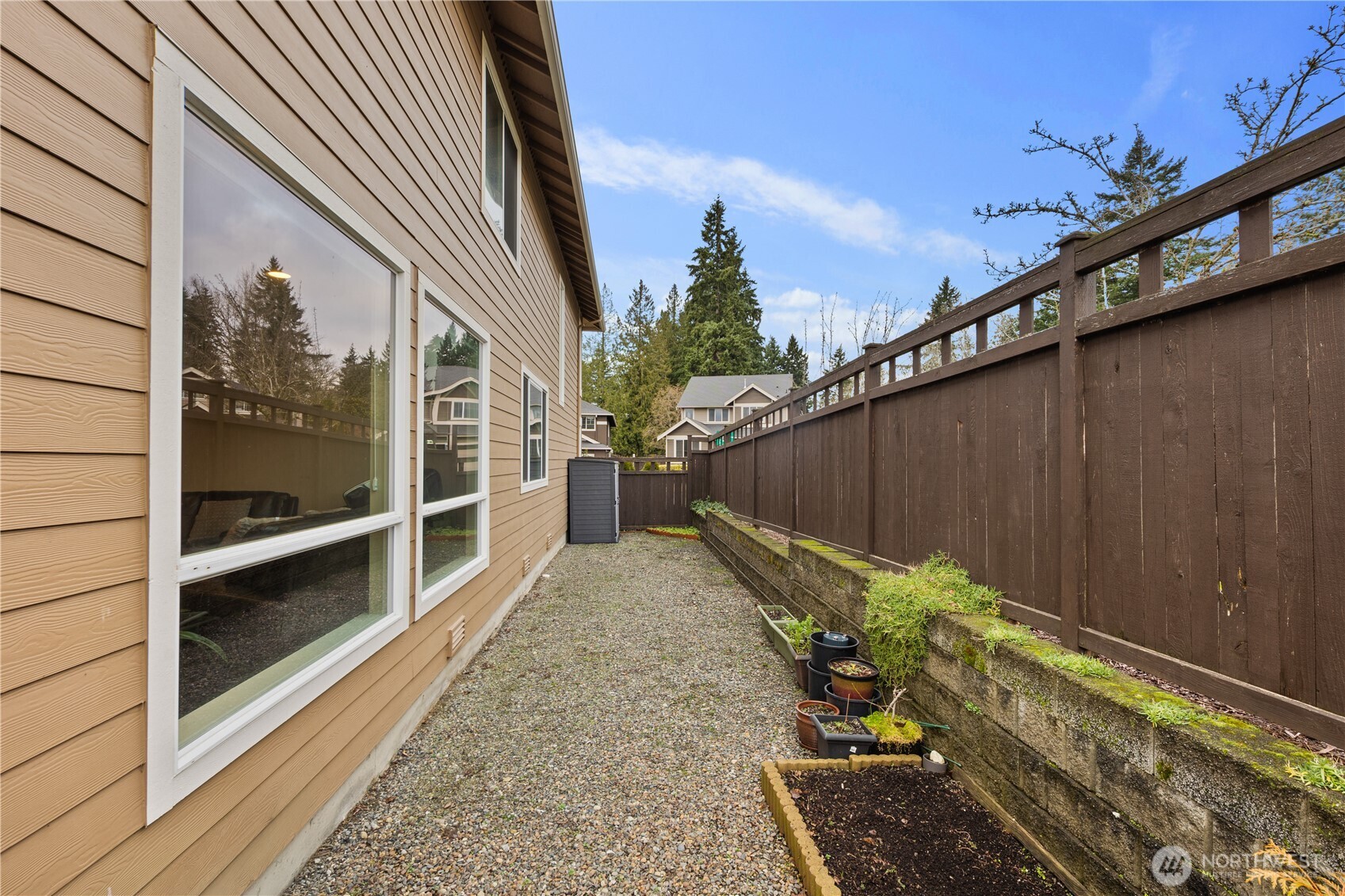 5627 South 336th Place Auburn, WA 98001 - Photo 37 of 40 a view of a balcony with wooden floor and fence