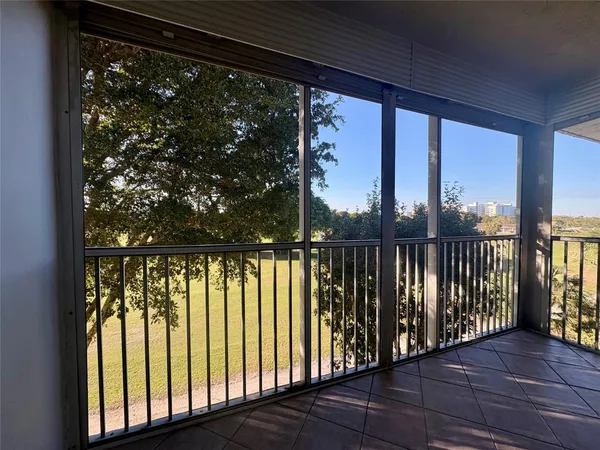 a view of a balcony with wooden floor