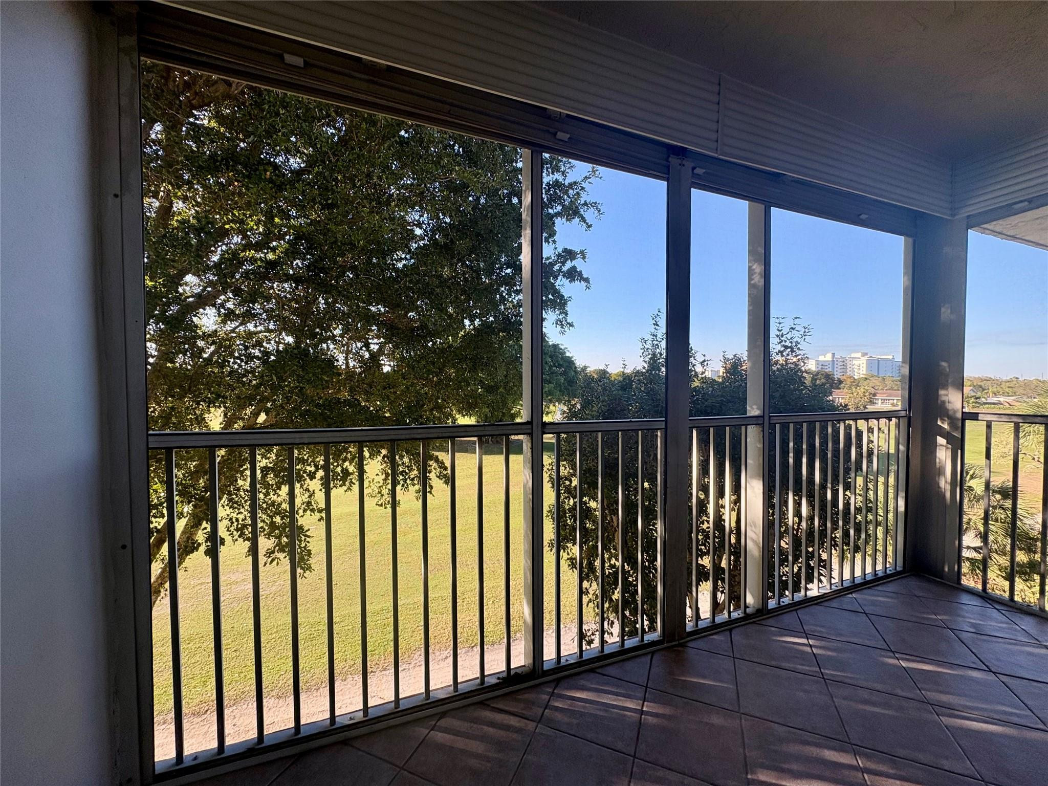2601 South Course Drive, Unit 406 Pompano Beach, FL 33069 - Photo 4 of 15 a view of a balcony with wooden floor