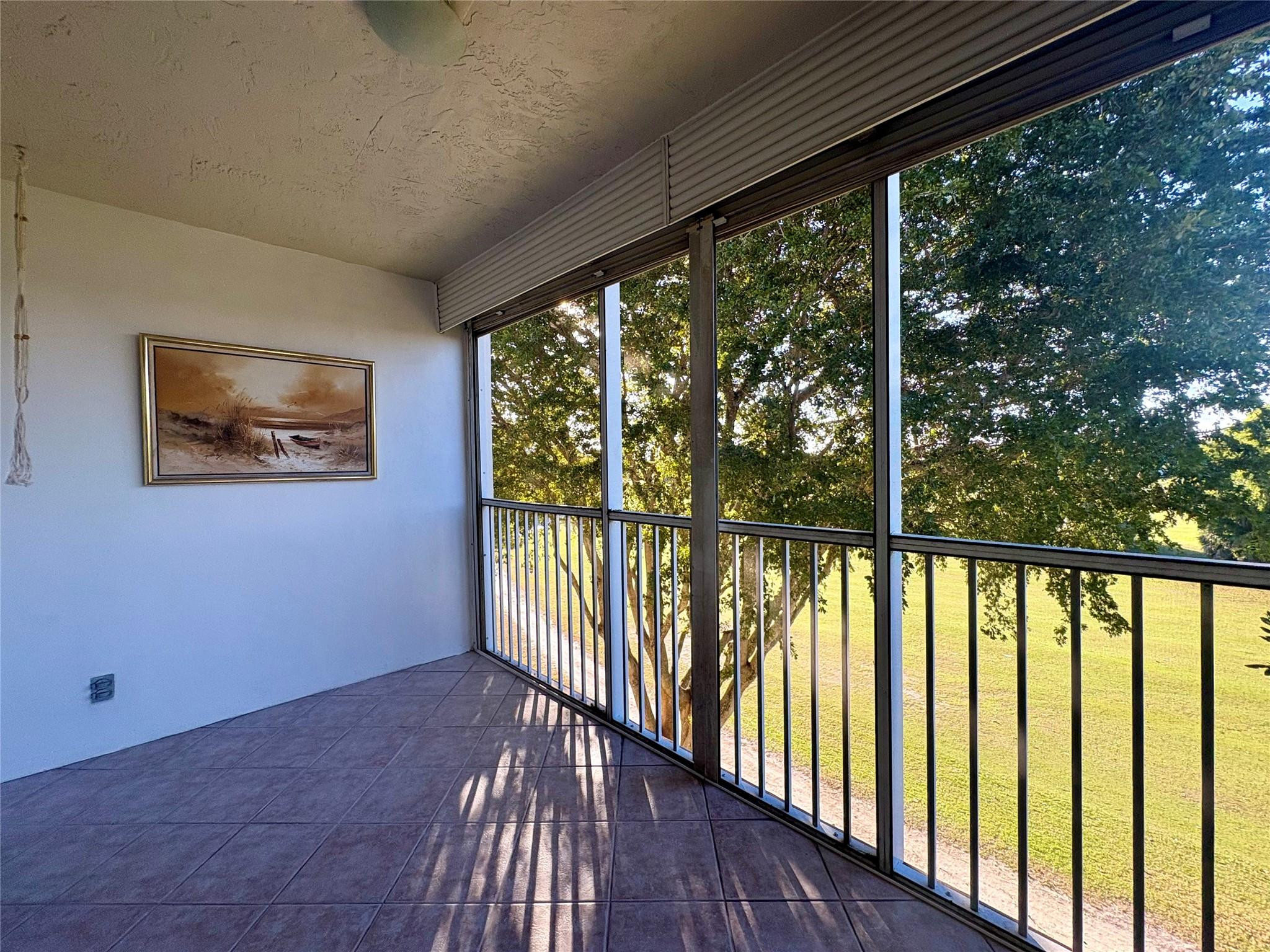 2601 South Course Drive, Unit 406 Pompano Beach, FL 33069 - Photo 5 of 15 a view of hallway with wooden floor