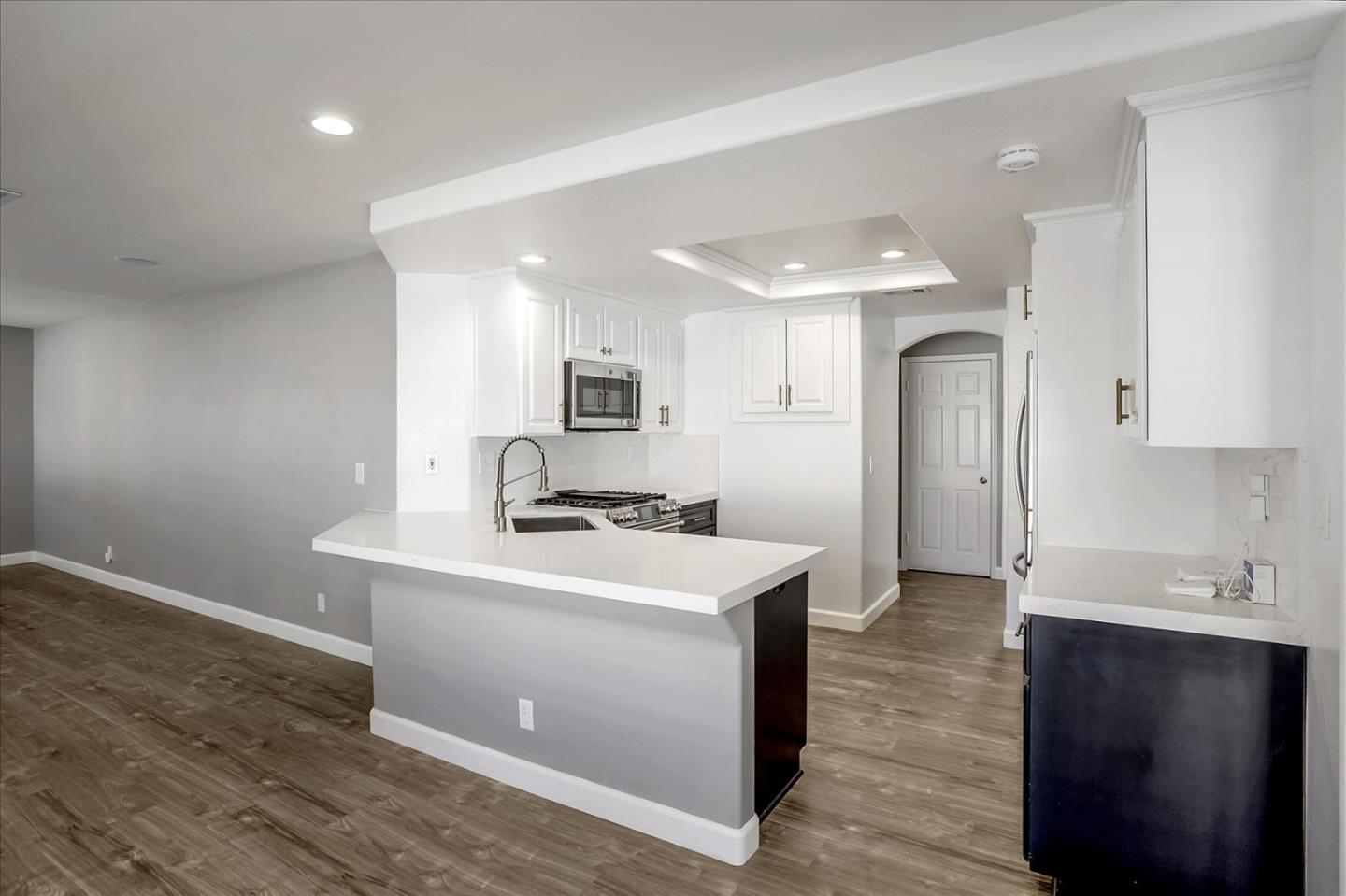 25307 Carson Way Stevenson Ranch, CA 91381 - Photo 11 of 36 a kitchen with a sink stainless steel appliances and cabinets