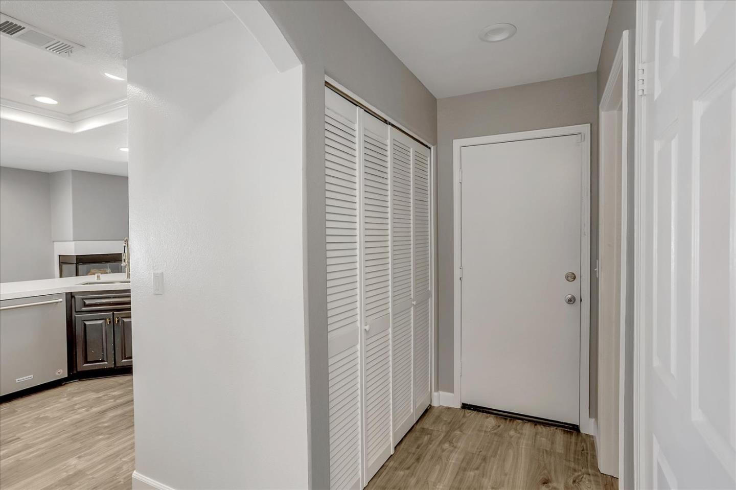 25307 Carson Way Stevenson Ranch, CA 91381 - Photo 15 of 36 a view of a kitchen with a sink and dishwasher wooden floor