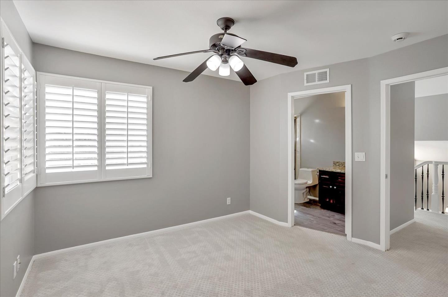 25307 Carson Way Stevenson Ranch, CA 91381 - Photo 20 of 36 a view of empty room with a ceiling fan and window