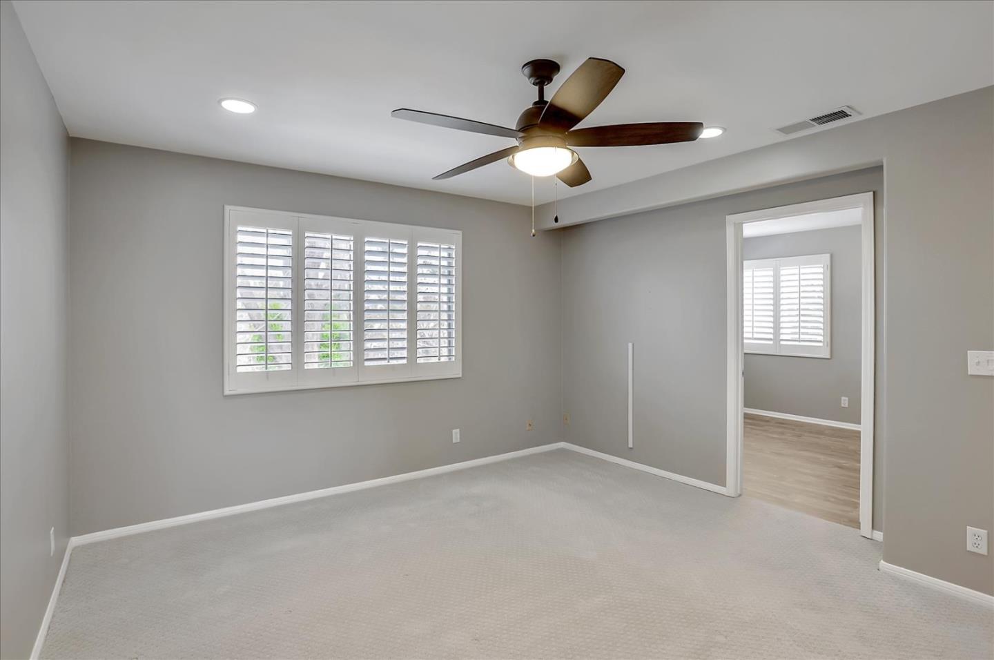 25307 Carson Way Stevenson Ranch, CA 91381 - Photo 23 of 36 an empty room with windows and fan