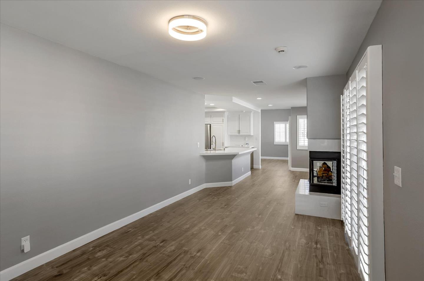 25307 Carson Way Stevenson Ranch, CA 91381 - Photo 10 of 36 a view of a kitchen with cabinets and wooden floor
