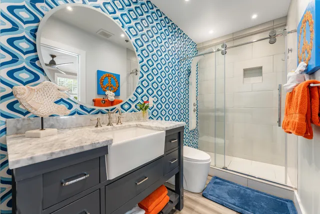 a bathroom with a sink toilet and shower