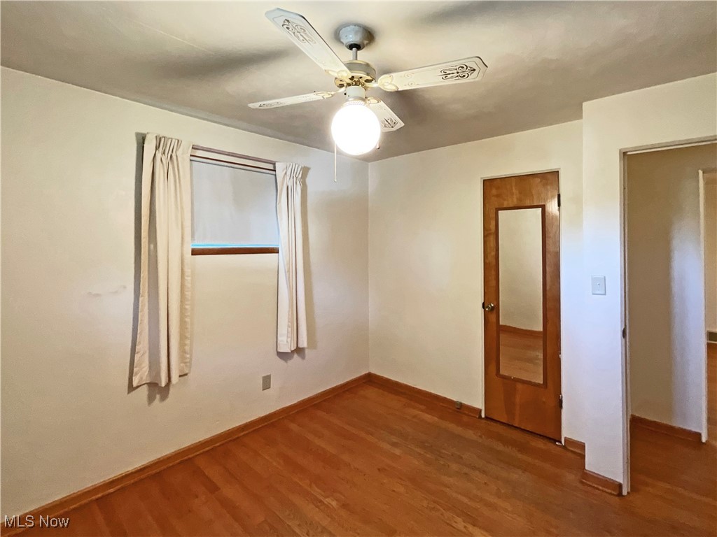 106 Ridgeway Avenue Weirton, WV 26062 - Photo 13 of 19 Unfurnished bedroom with wood-type flooring and ceiling fan
