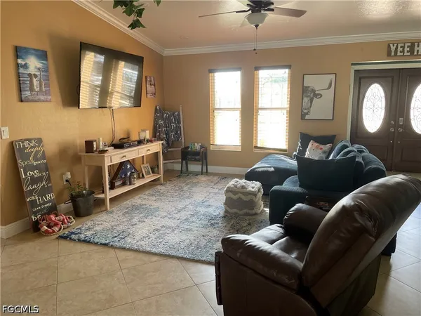 a living room with furniture and a window