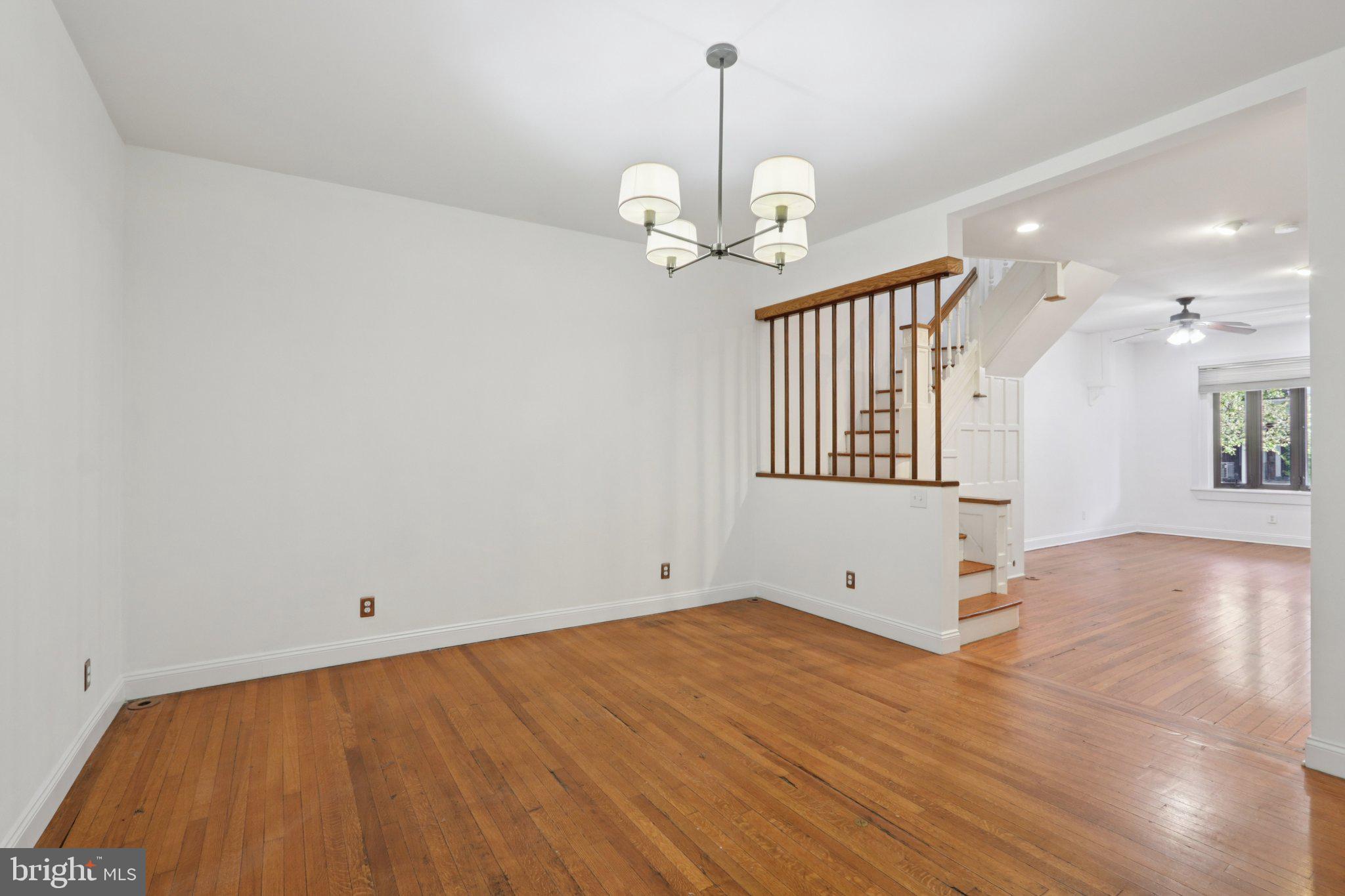 508 South 49th Street Philadelphia, PA 19143 - Photo 11 of 51 a view of a room with wooden floor and ceiling fan