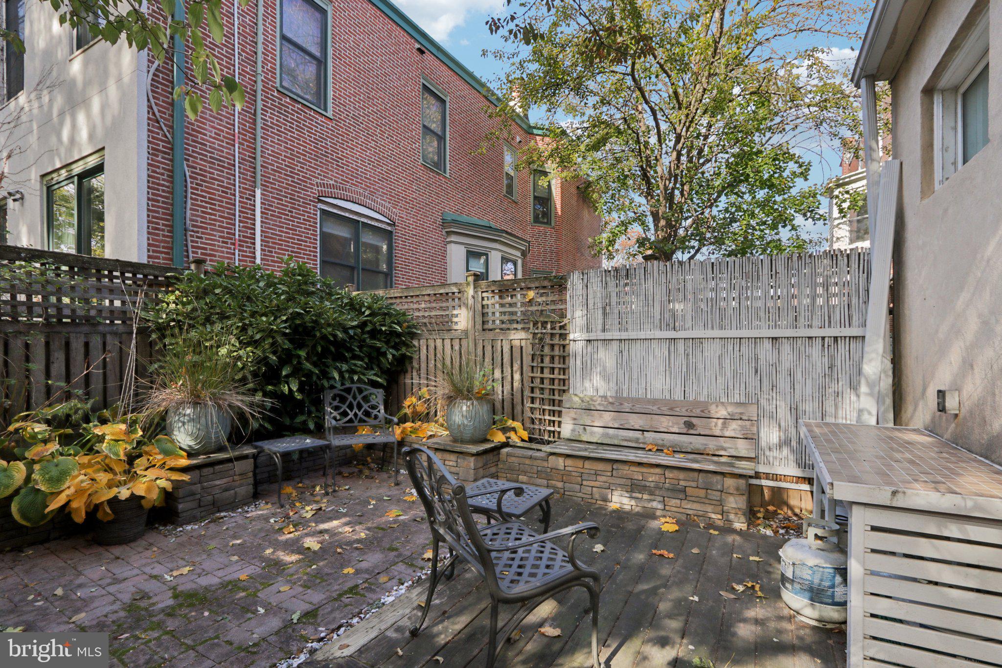 508 South 49th Street Philadelphia, PA 19143 - Photo 21 of 51 a backyard of a house with outdoor seating