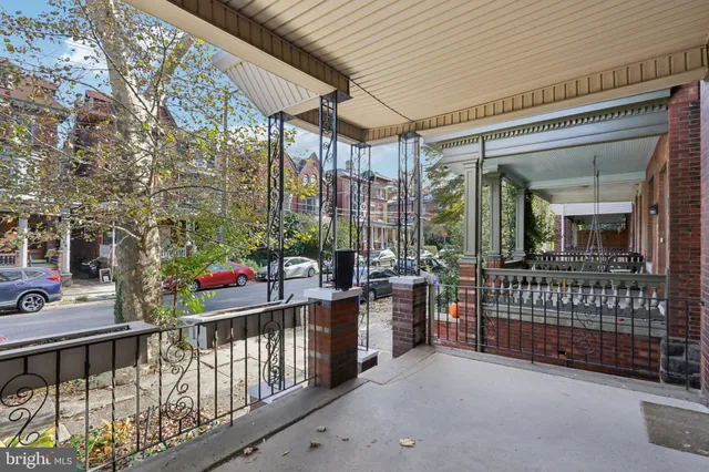 a view of a house with a wooden fence