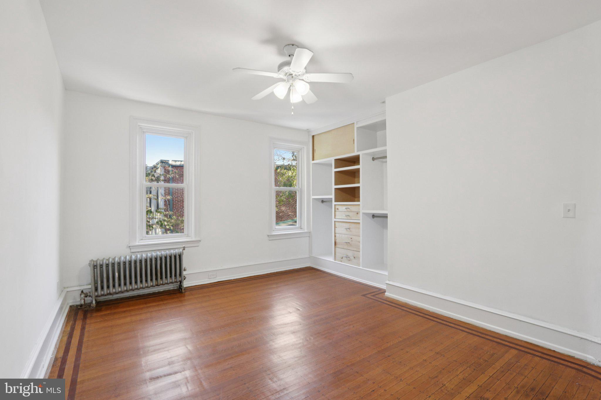 508 South 49th Street Philadelphia, PA 19143 - Photo 34 of 51 wooden floor in an empty room with a window