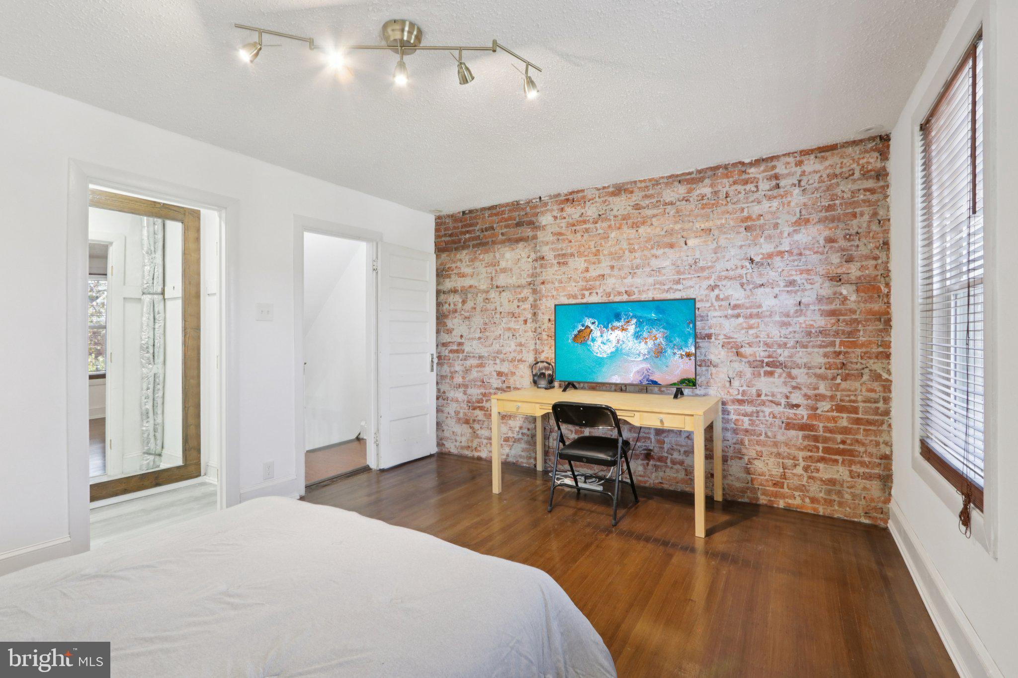 508 South 49th Street Philadelphia, PA 19143 - Photo 38 of 51 a bedroom with a bed and a desk