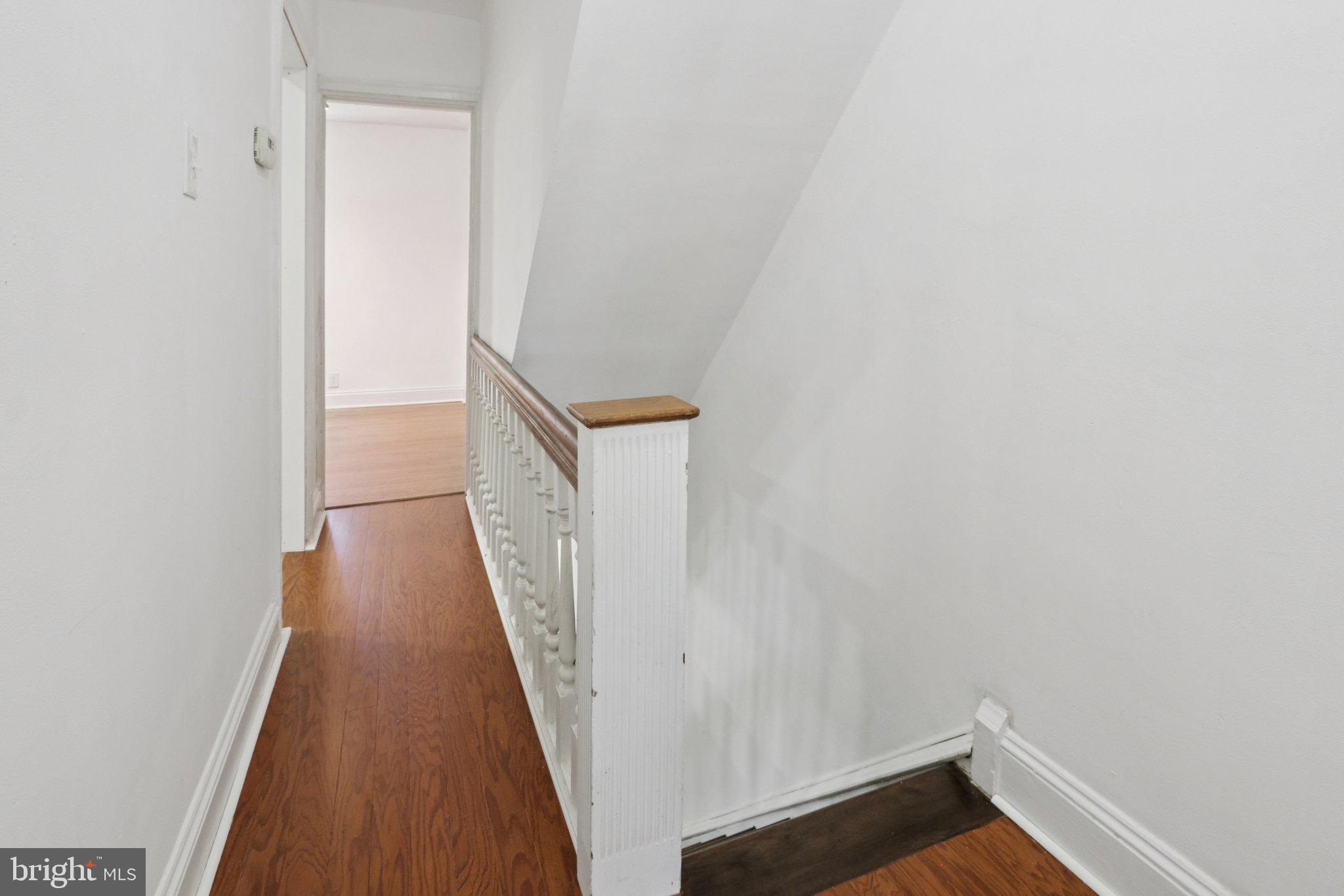 508 South 49th Street Philadelphia, PA 19143 - Photo 42 of 51 a view of a hallway with wooden floor