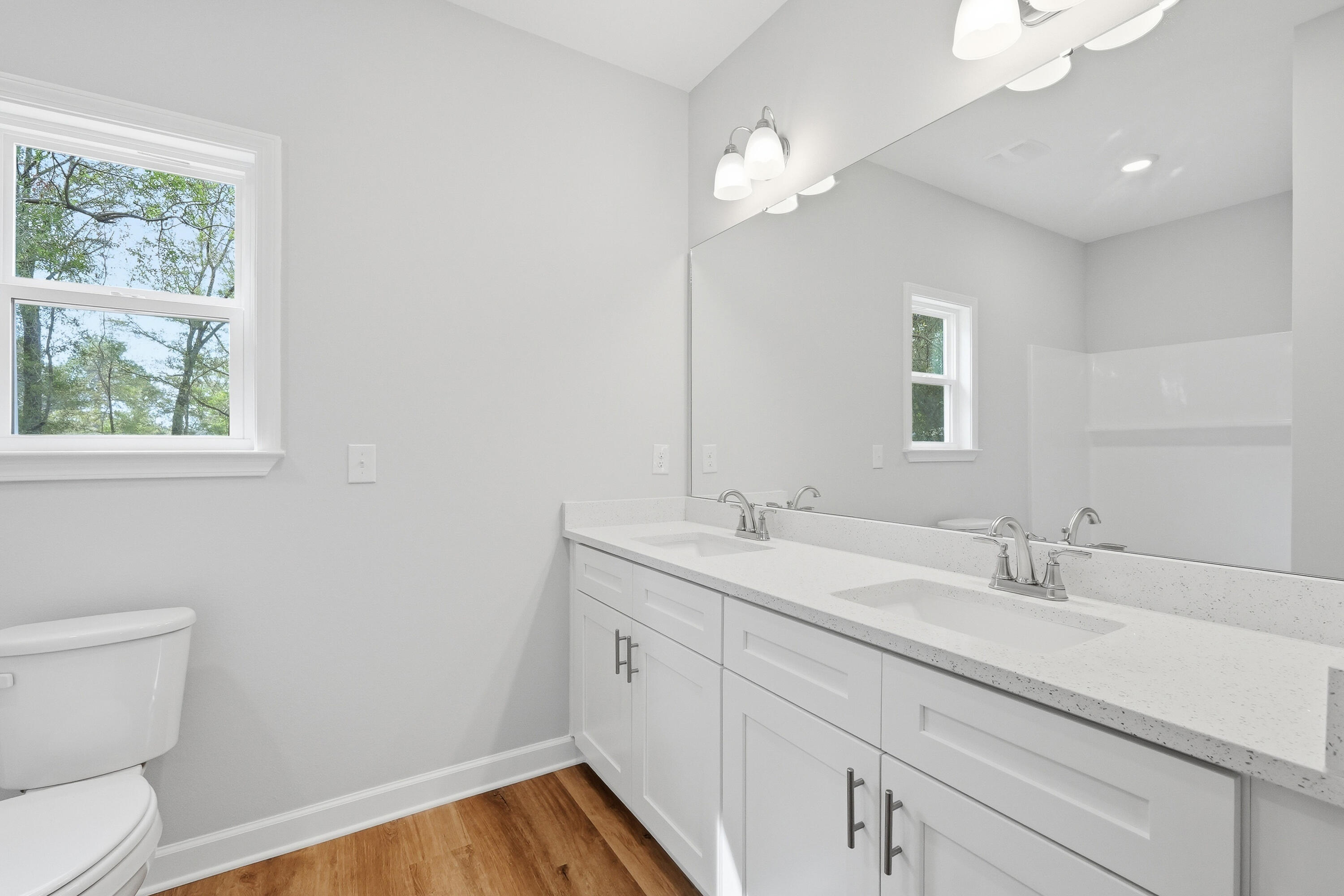 2588 Kingston Road Crestview, FL 32536 - Photo 13 of 23 a bathroom with a sink a toilet and a mirror
