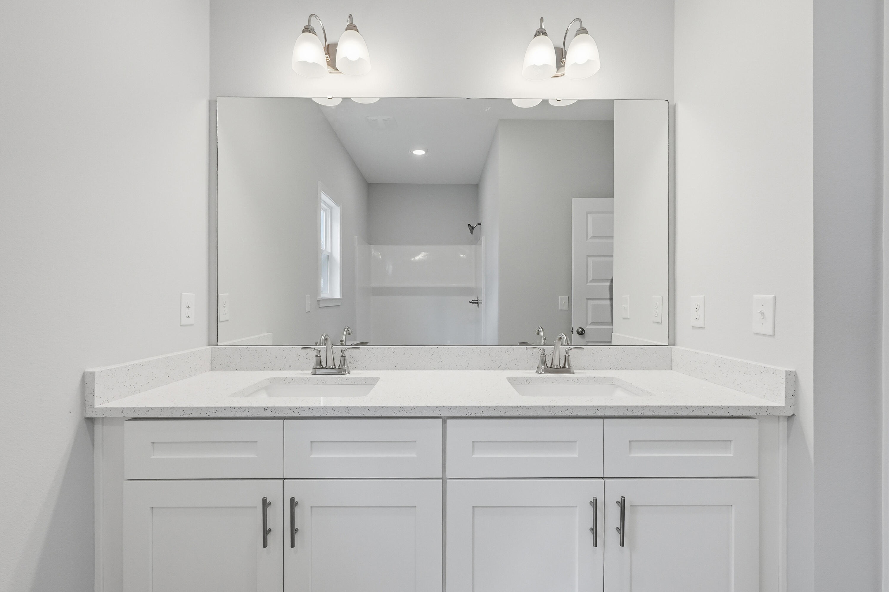 2588 Kingston Road Crestview, FL 32536 - Photo 14 of 23 a bathroom with a sink and a mirror