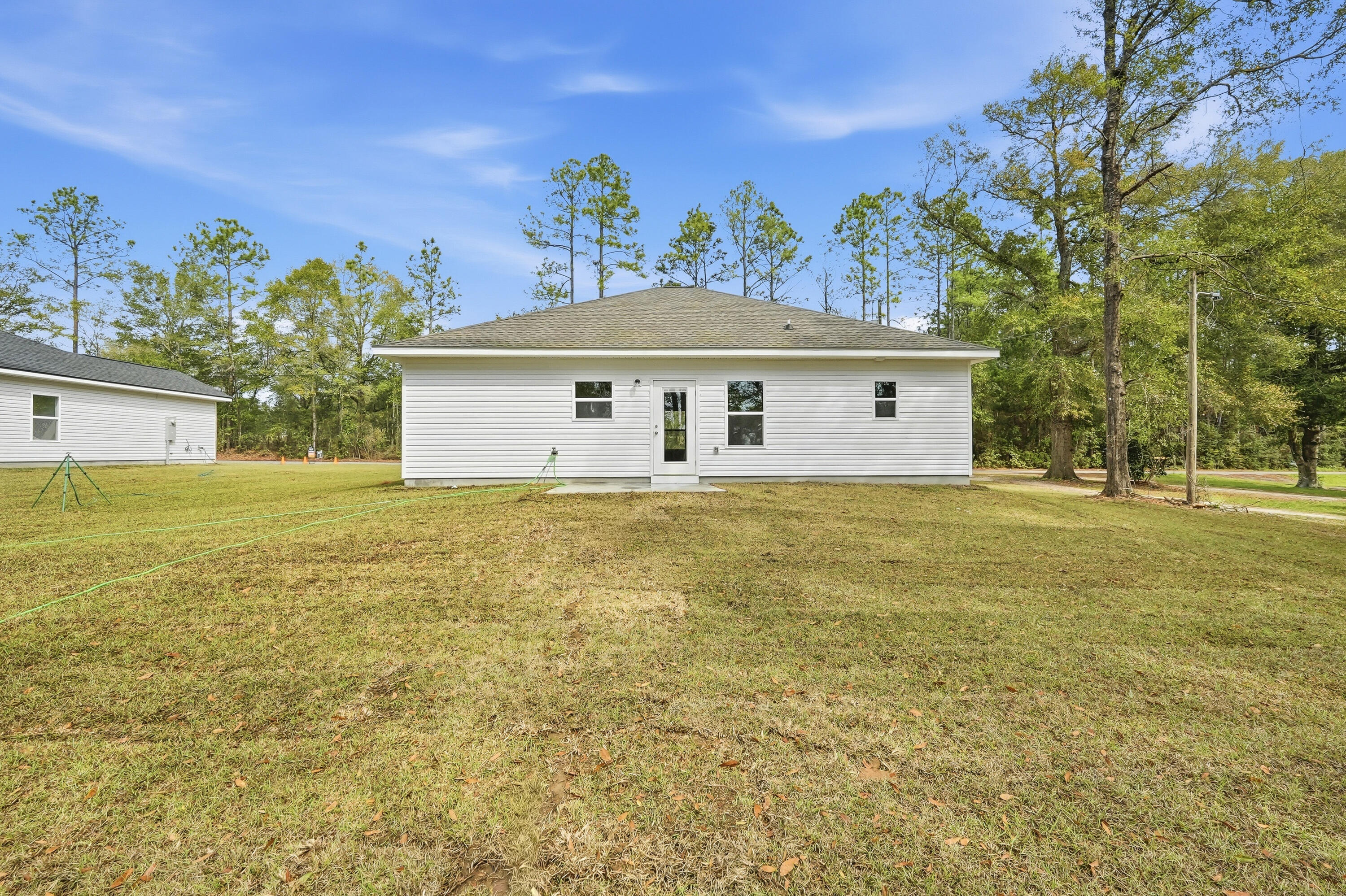 2588 Kingston Road Crestview, FL 32536 - Photo 23 of 23 a front view of a house with a garden