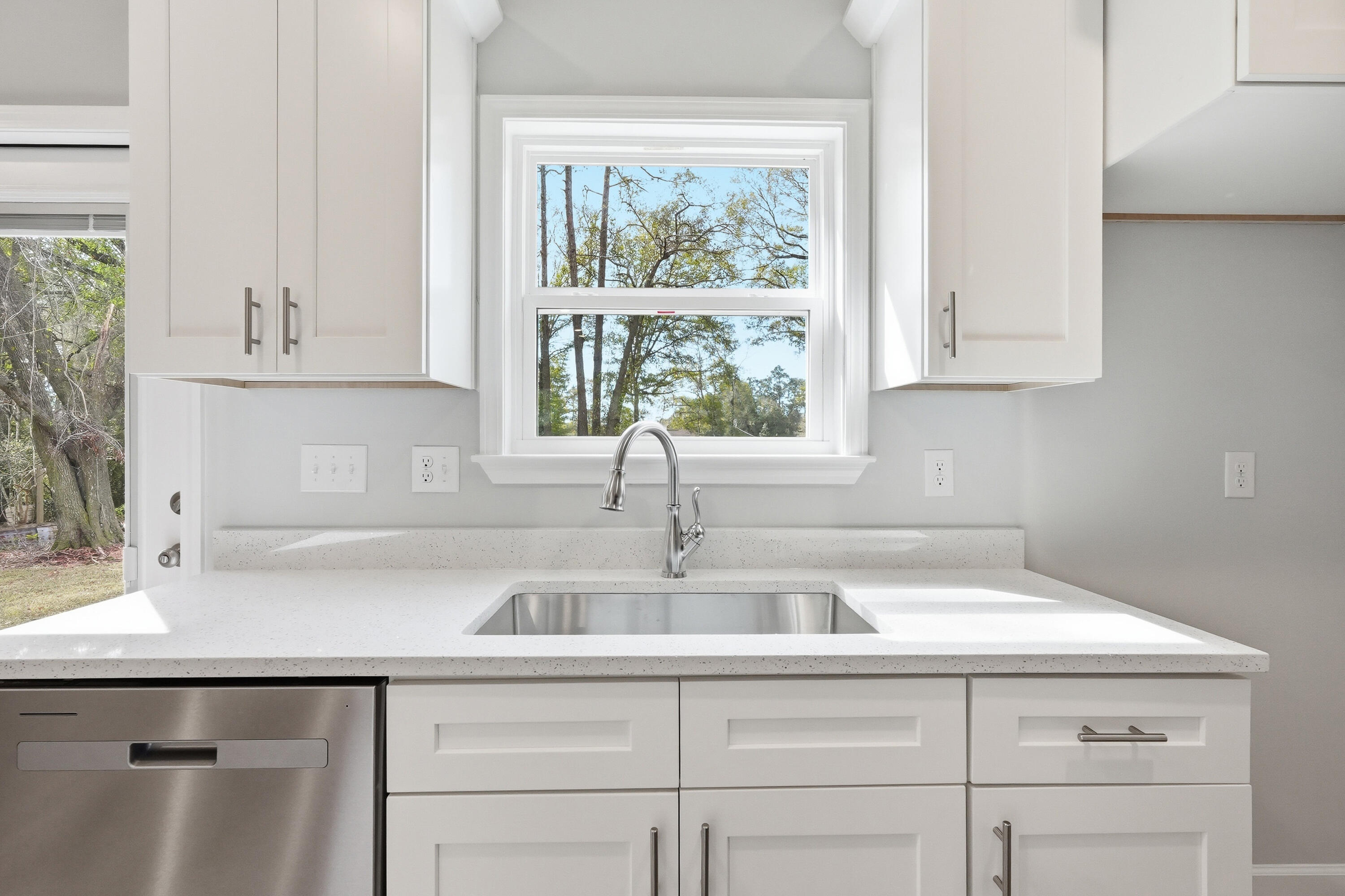 2588 Kingston Road Crestview, FL 32536 - Photo 10 of 23 a kitchen with stainless steel appliances white cabinets and a sink
