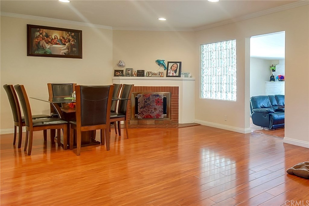 7863 Lyndora Street Downey, CA 90242 - Photo 12 of 27 a view of a dining room with furniture and wooden floor