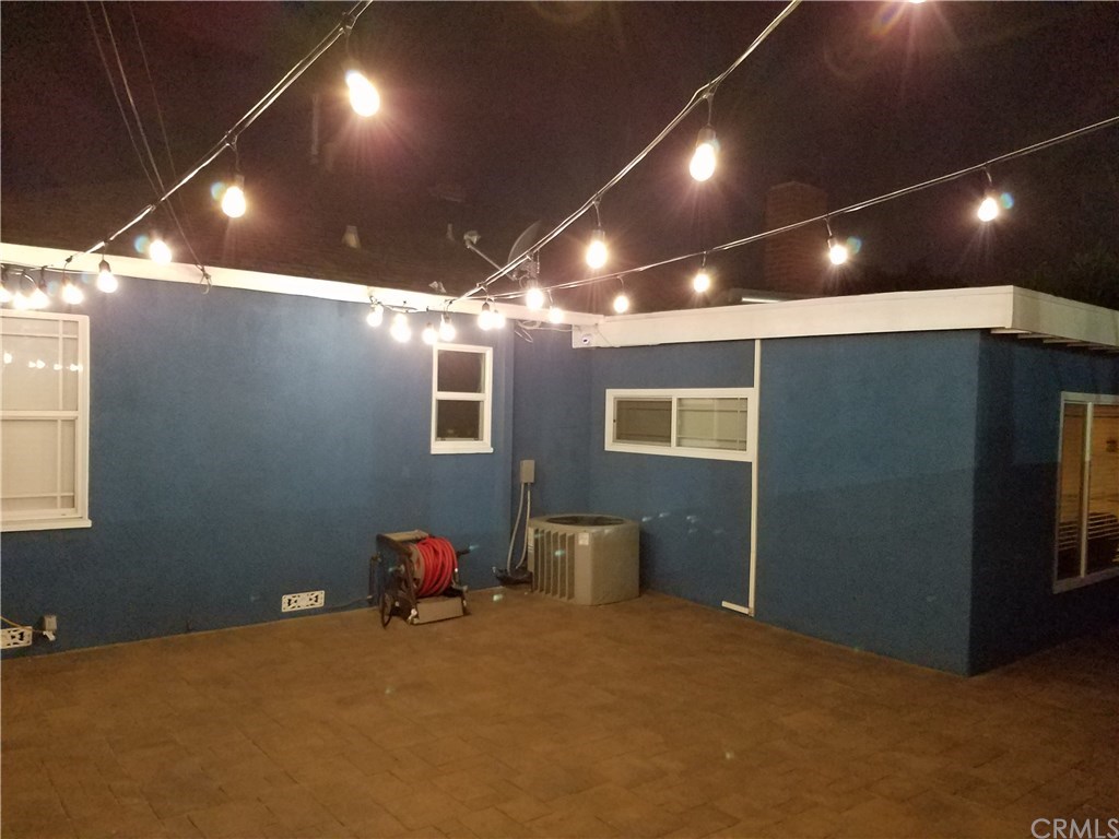 7863 Lyndora Street Downey, CA 90242 - Photo 21 of 27 a room with furniture and window