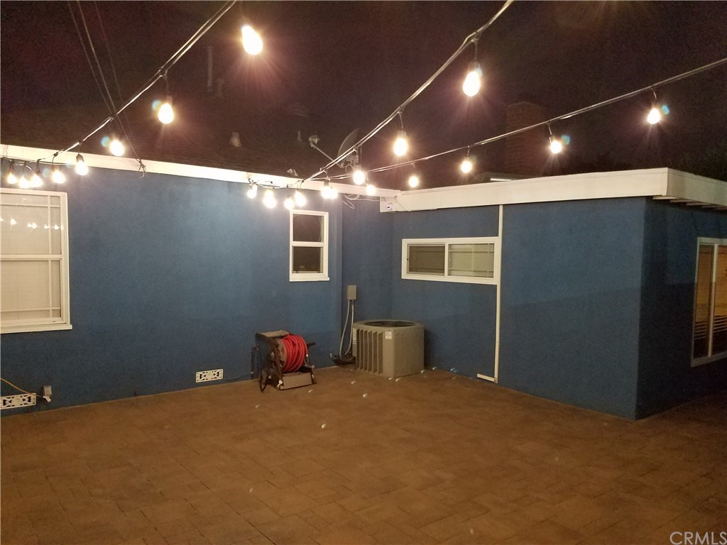 7863 Lyndora Street Downey, CA 90242 - Photo 22 of 27 a room with furniture and window