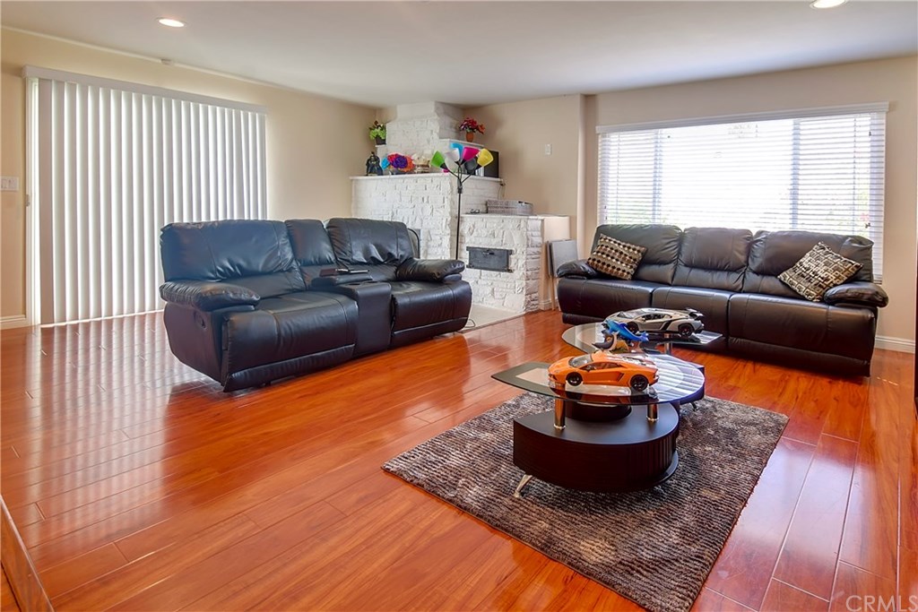 7863 Lyndora Street Downey, CA 90242 - Photo 5 of 27 a living room with furniture and a window
