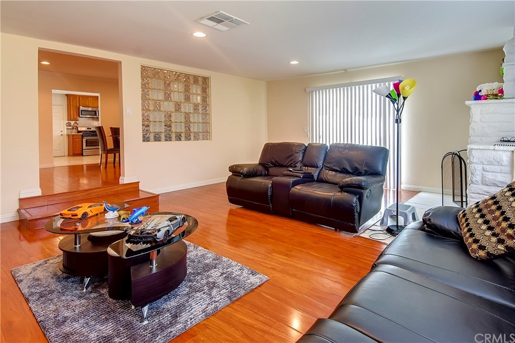7863 Lyndora Street Downey, CA 90242 - Photo 6 of 27 a living room with furniture rug and window