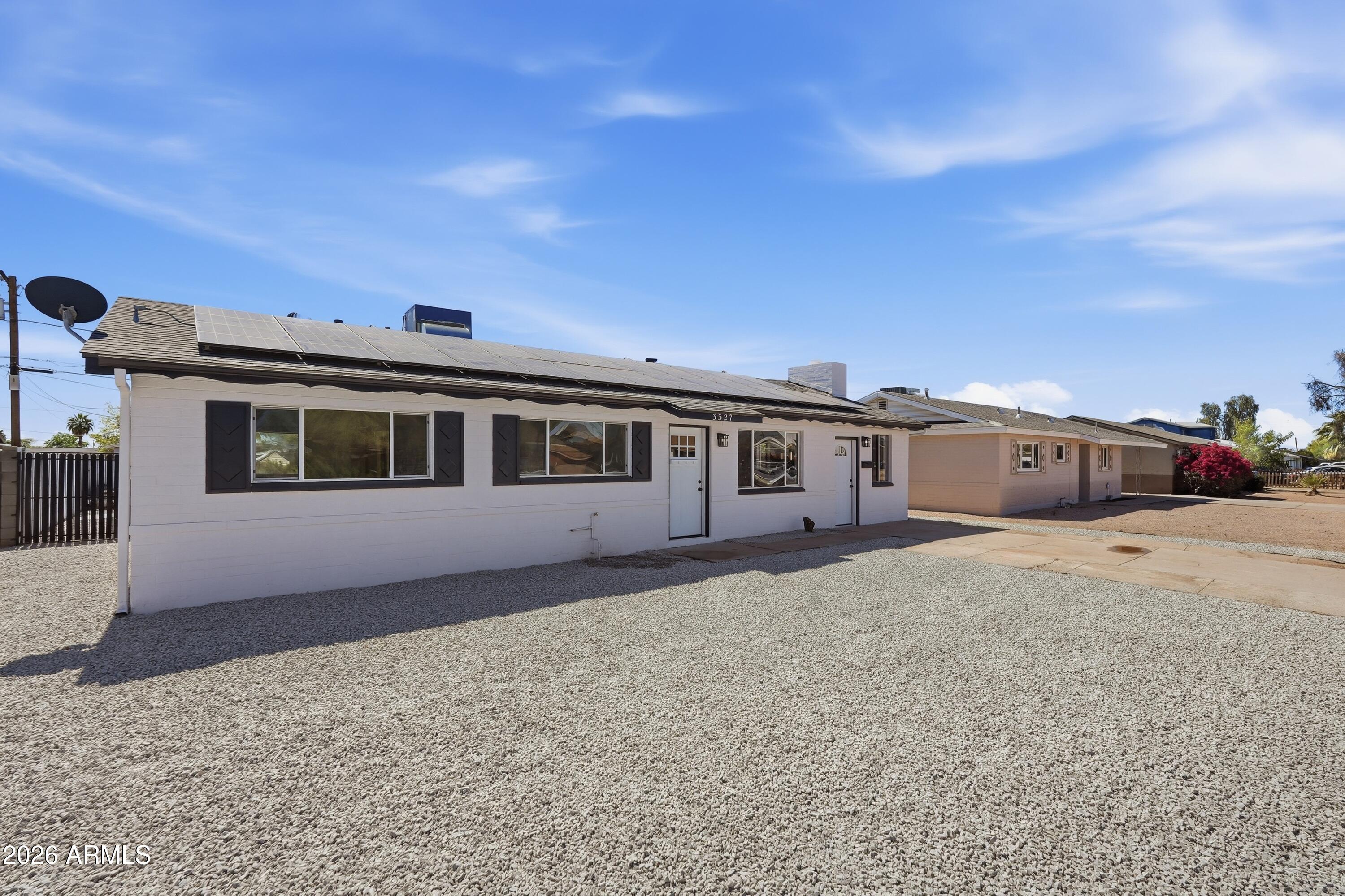 3327 West Wethersfield Road Phoenix, AZ 85029 - Photo 16 of 30 a front view of a house with a yard