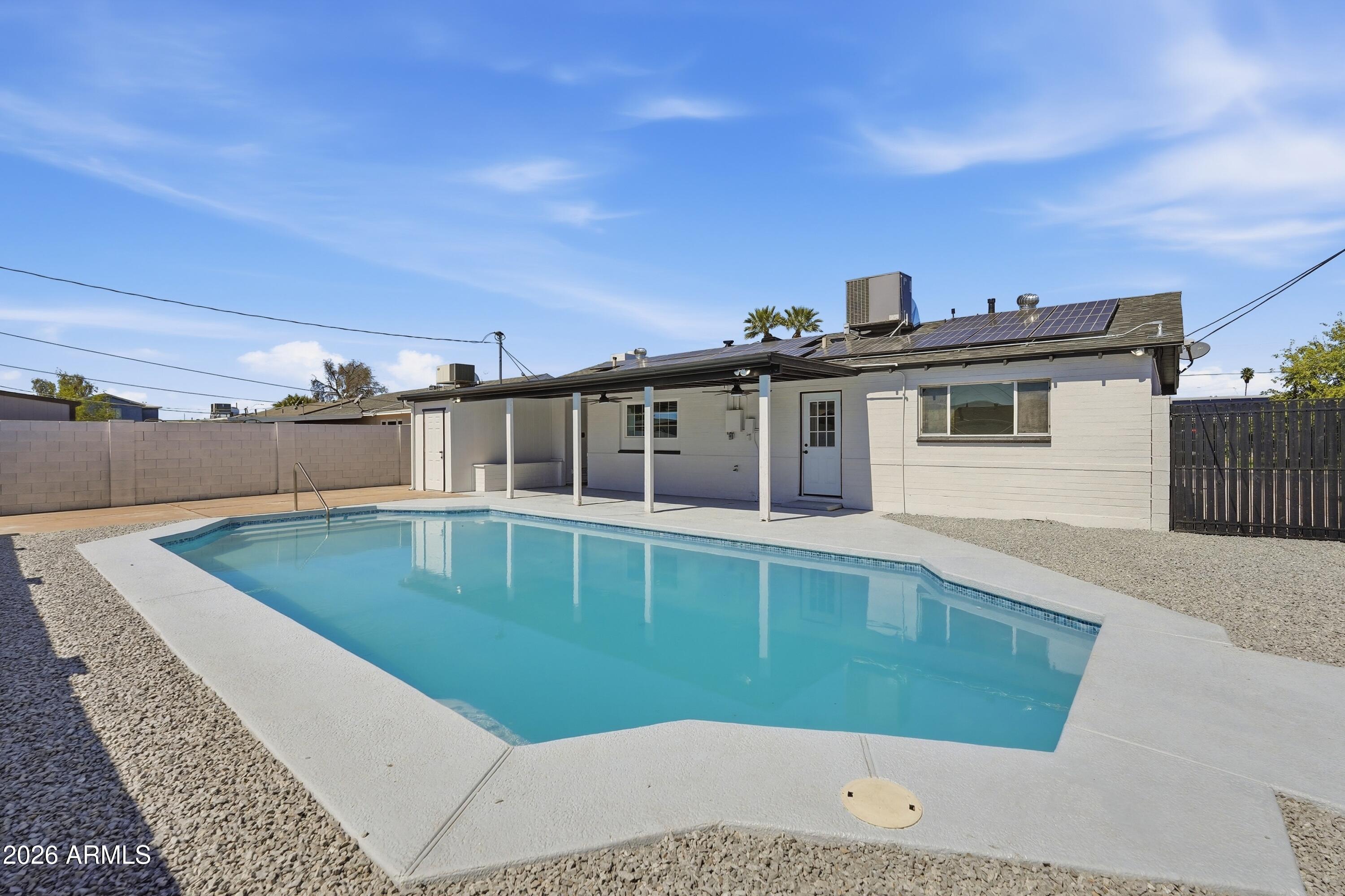 3327 West Wethersfield Road Phoenix, AZ 85029 - Photo 29 of 30 a view of a house with a backyard