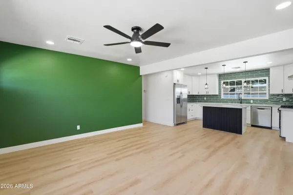a view of kitchen with cabinets and stainless steel appliances
