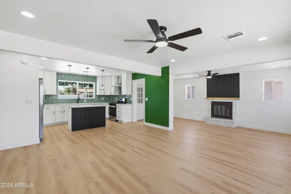 a view of kitchen with cabinets and stainless steel appliances