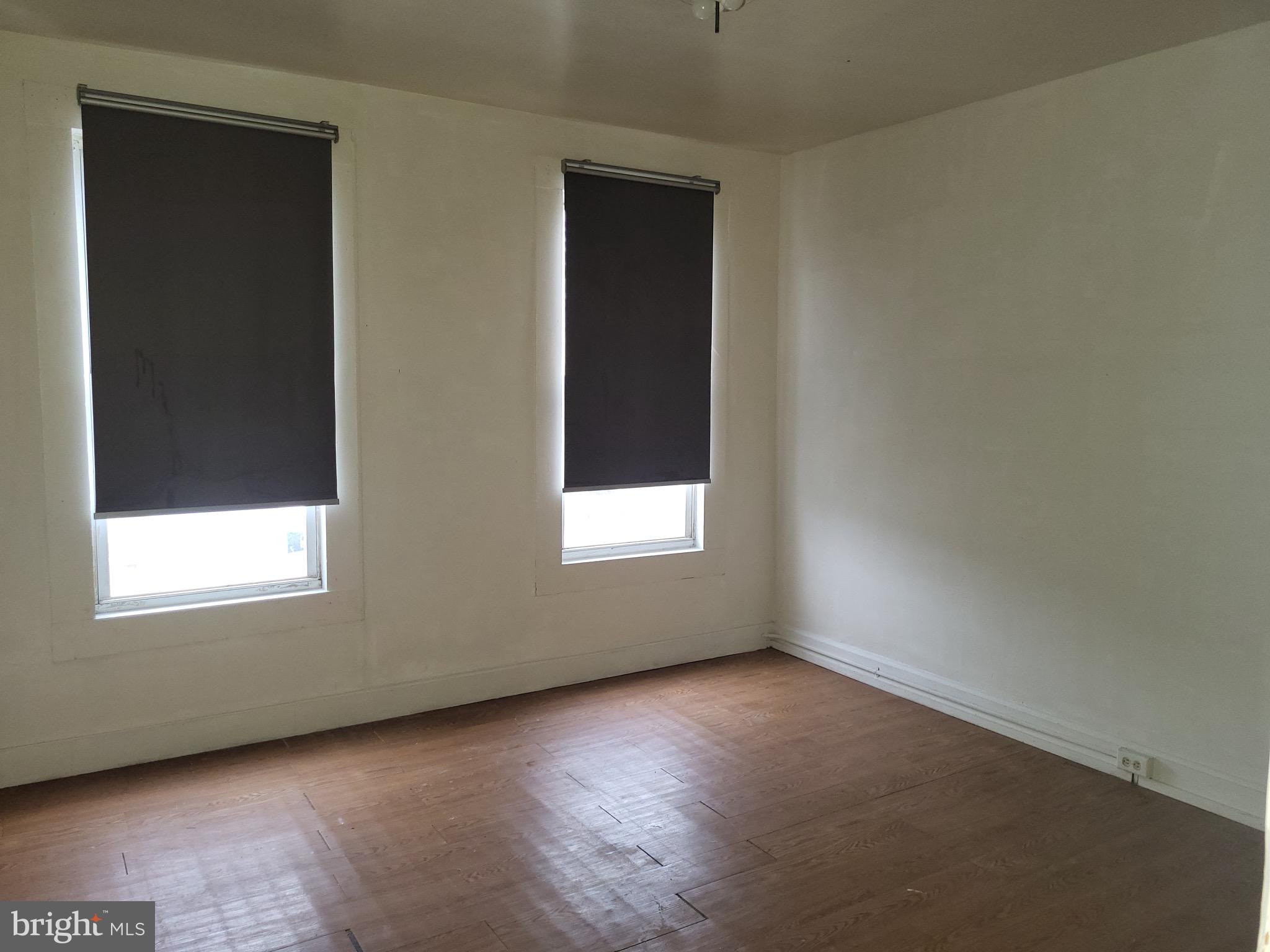 423 Furrow Street Baltimore, MD 21223 - Photo 7 of 13 an empty room with a window
