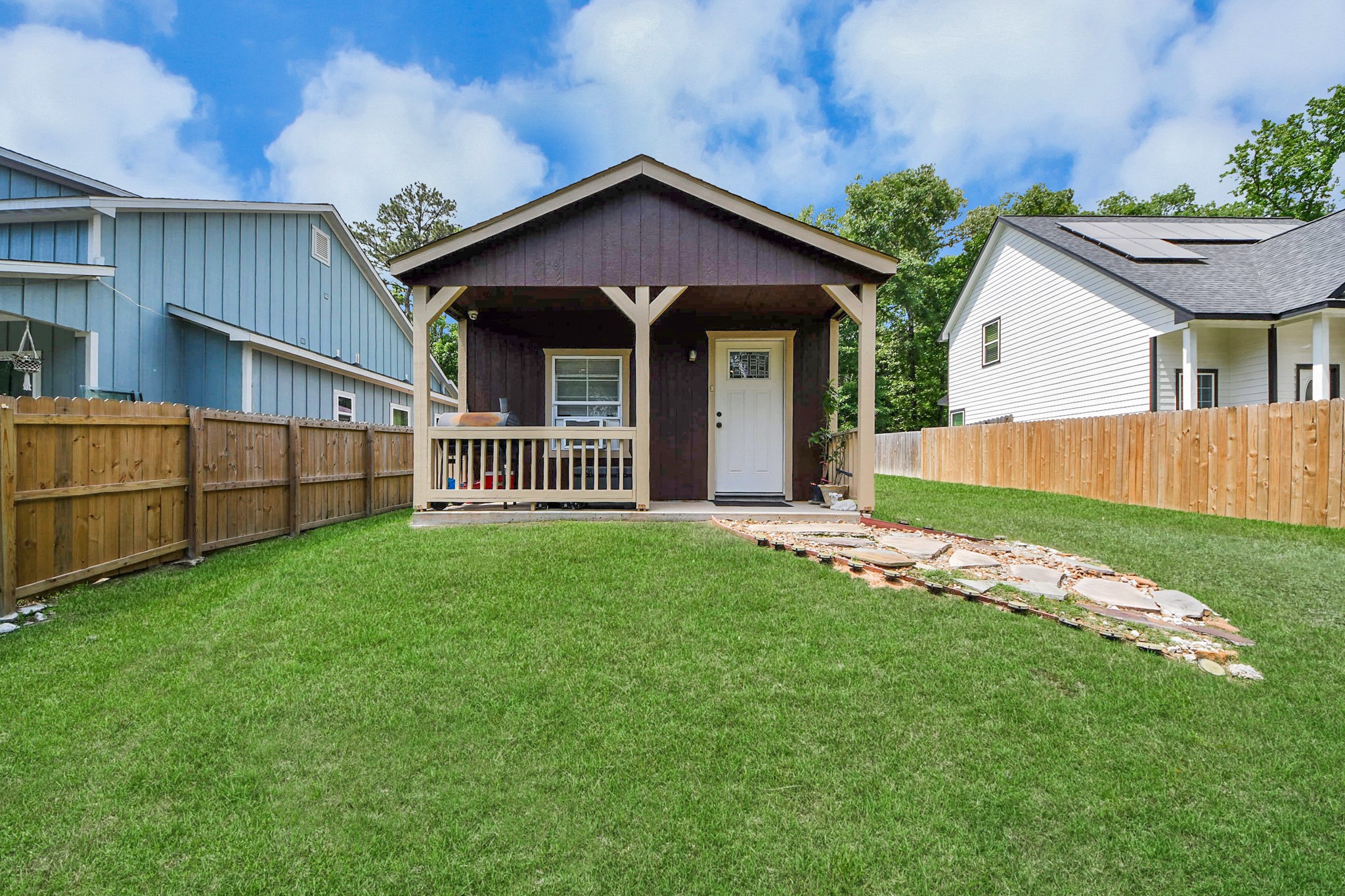 14961 Lamar Road Willis, TX 77378 - Photo 2 of 31 Charming front elevation with covered porch and fully fenced yard for privacy (installed Feb 2026).