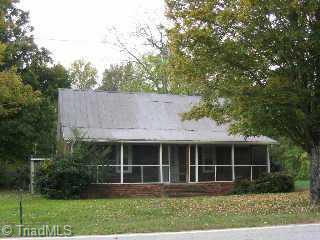 1526 Yadkin Valley Road Advance, NC 27006 - Photo 1 of 8 Exterior Front. Main house with screened porch, 1 bedroom, 1 possible upstairs bedroom, 1 bath, kitchen, living & den