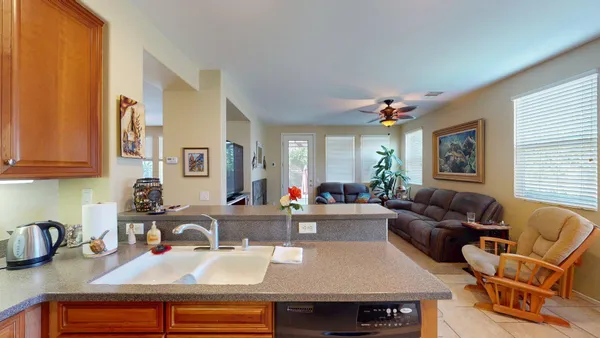 a living room with furniture a couch and a window