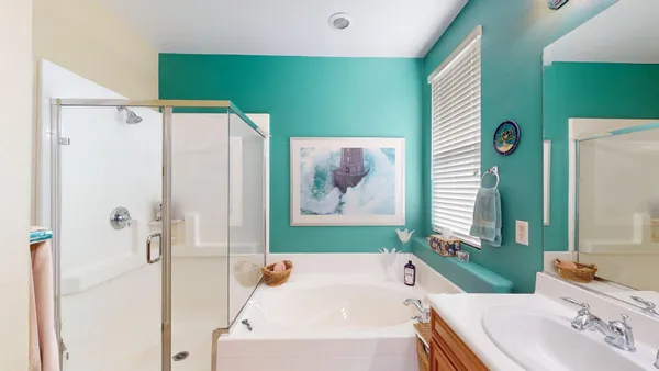 a bathroom with a sink a toilet and shower curtain