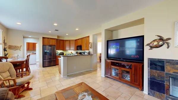 a kitchen with granite countertop wood cabinets and stainless steel appliances
