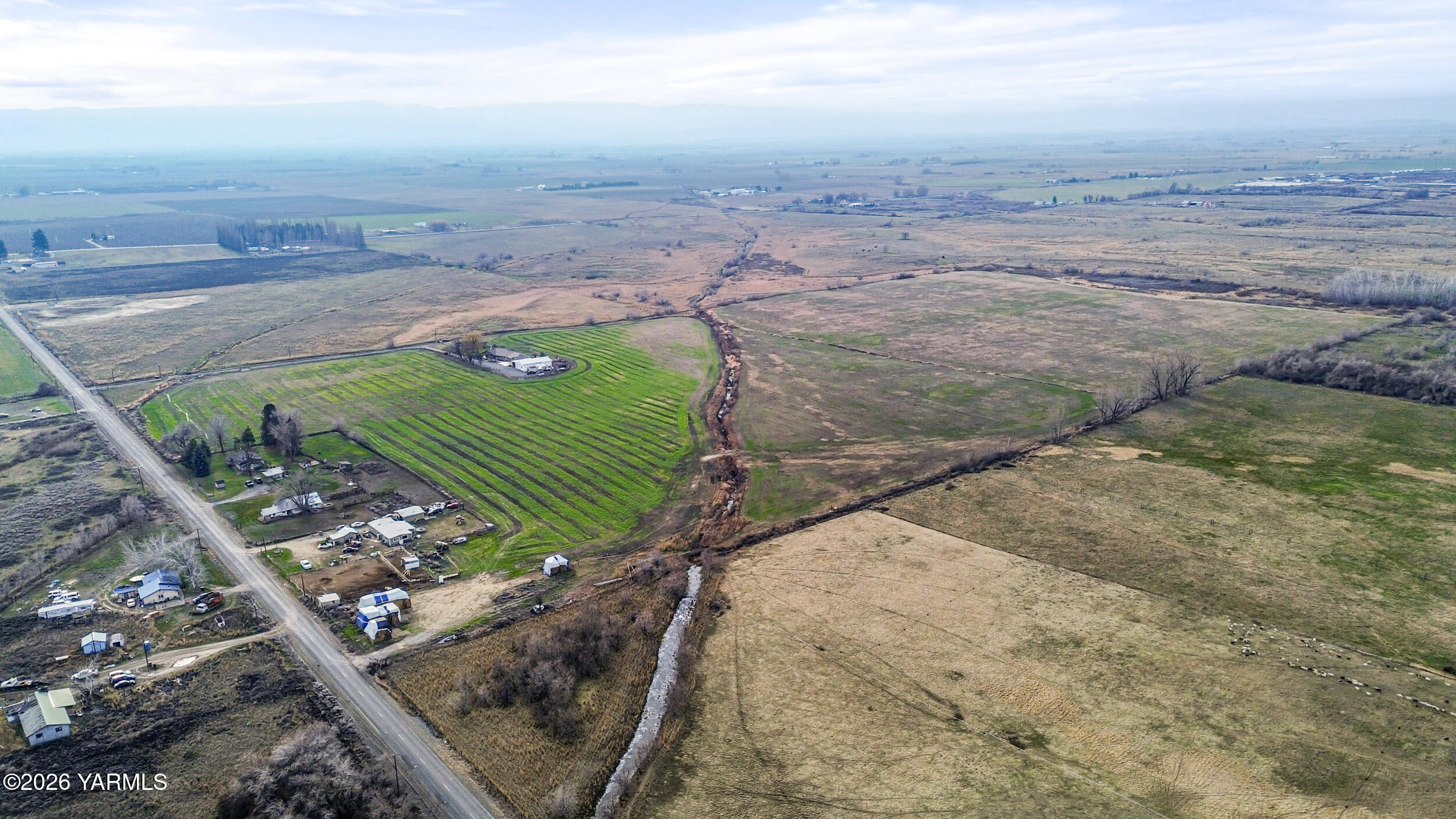 Nka Shields Road Wapato, WA 98951 - Photo 6 of 14 a view of a dry yard with wooden fence