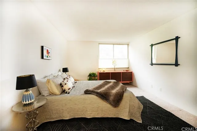 a bedroom with a bed and a cabinets