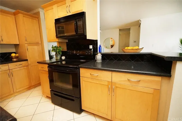 a bed room with a bed and a chair