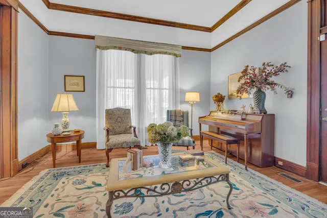 a living room with furniture and a rug