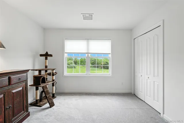 a room with furniture and a window