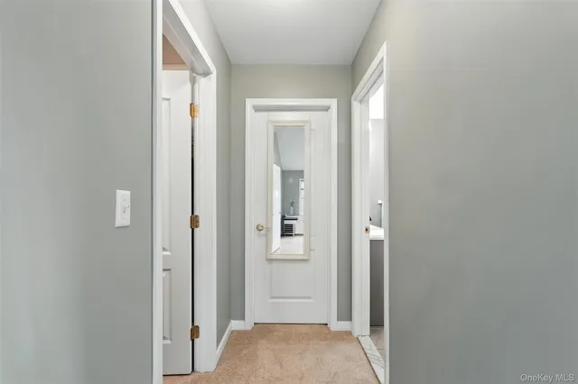 a bedroom with a bed and a lamp