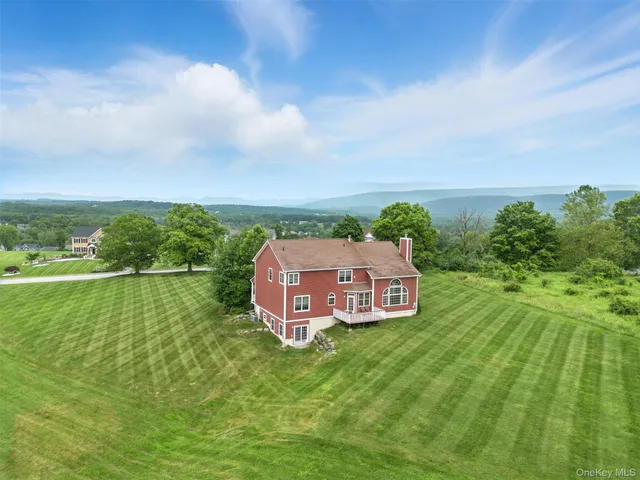 a aerial view of a house with a big yard