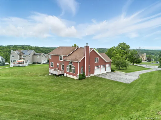 a view of a park with large trees
