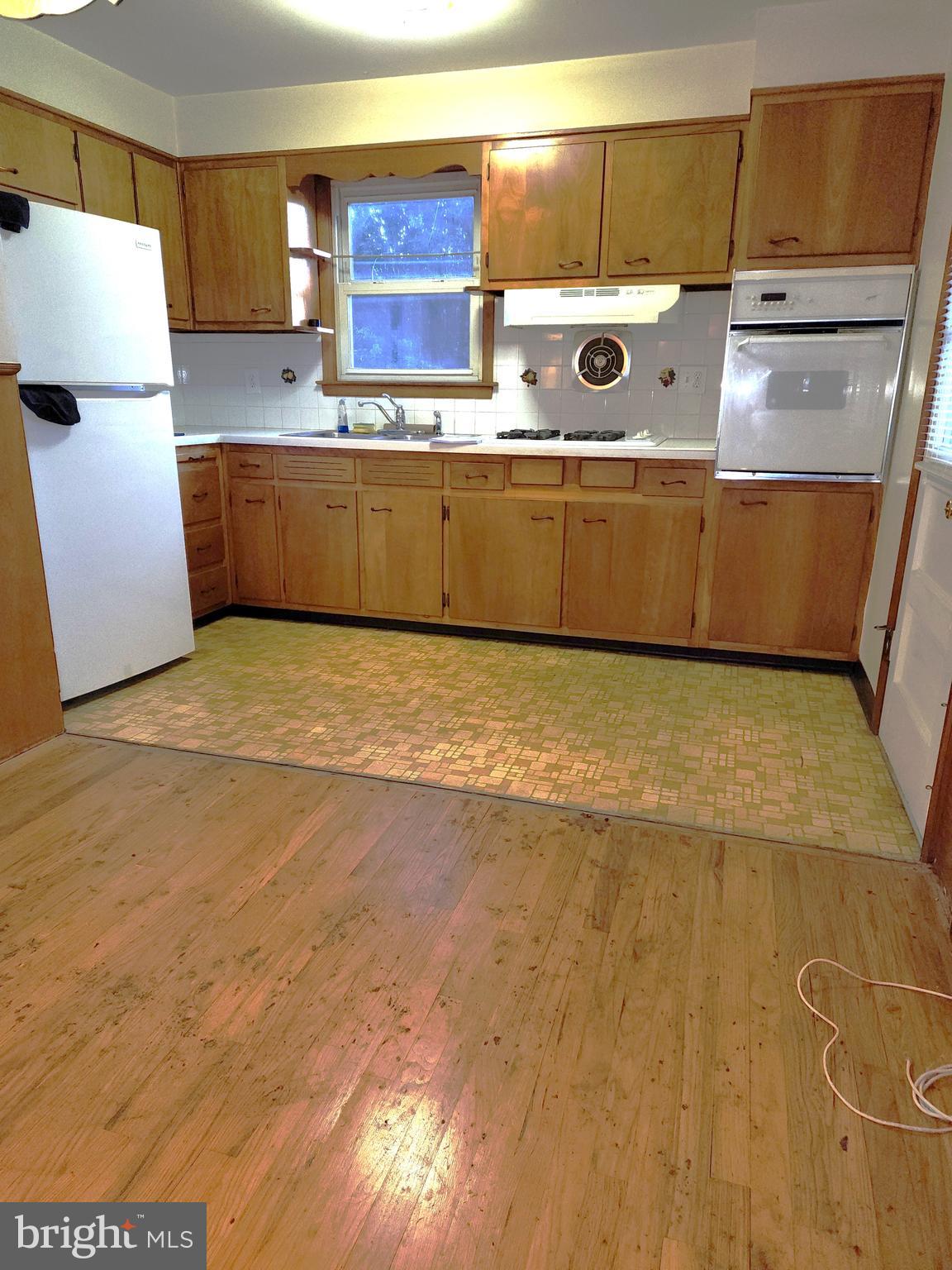 7 Saranac Road Hamilton, NJ 08619 - Photo 11 of 19 a view of kitchen with stainless steel appliances granite countertop cabinets and a couch