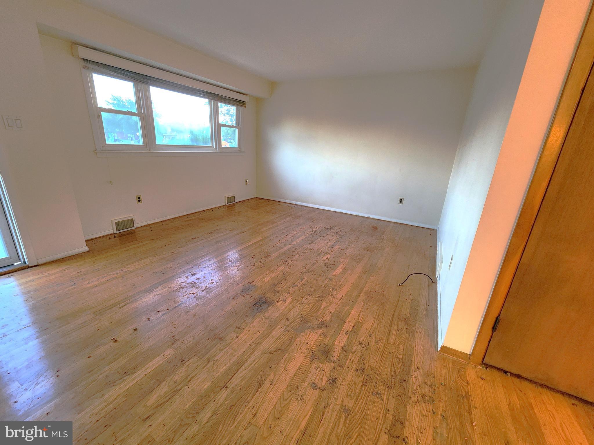 7 Saranac Road Hamilton, NJ 08619 - Photo 5 of 19 an empty room with wooden floor and windows